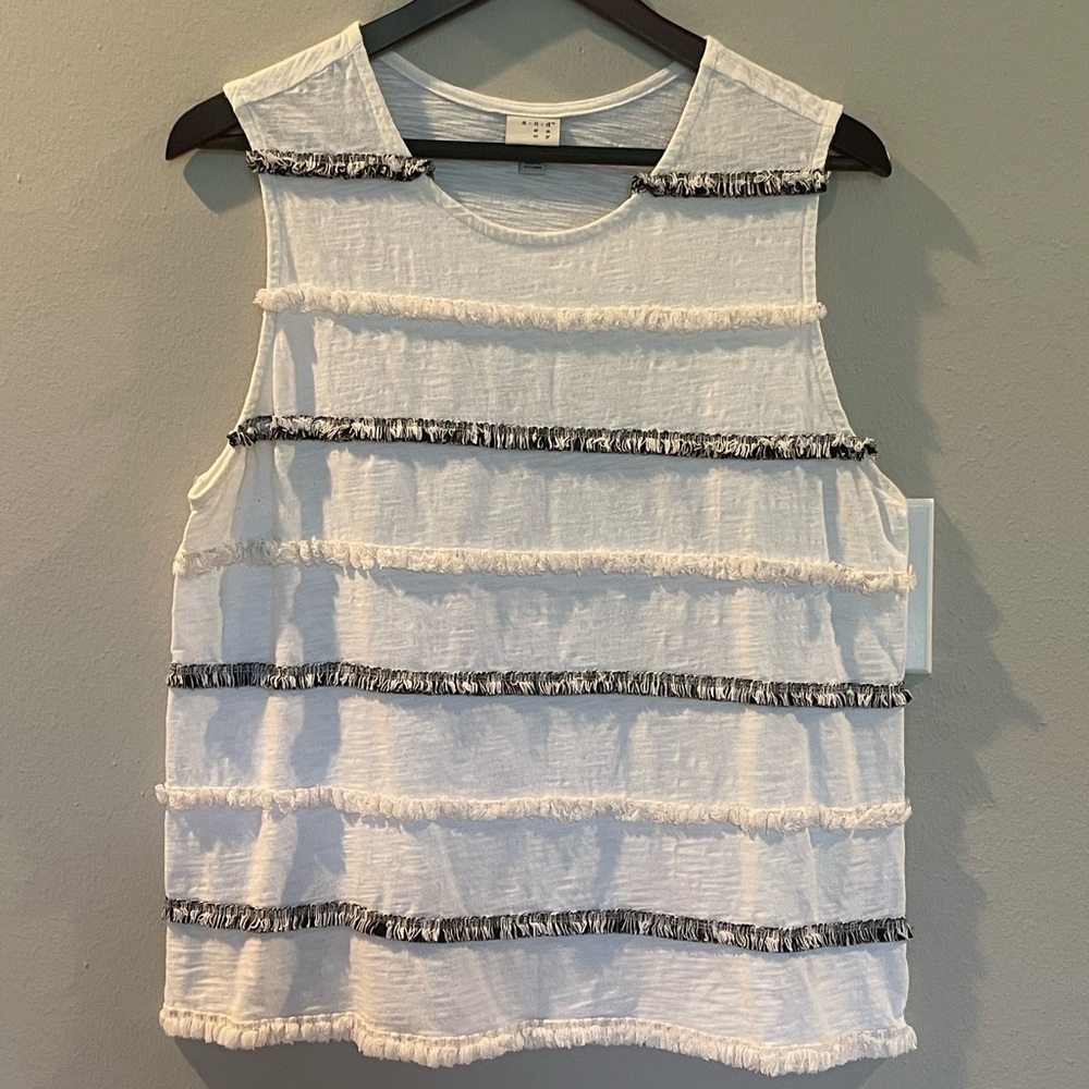 Fun sleeveless knit top with stripes of “fringe”